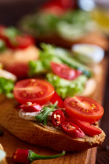 Breakfast still life with sandwiches, quail eggs, spicies and fresh fruits and vegetables, selective focus
