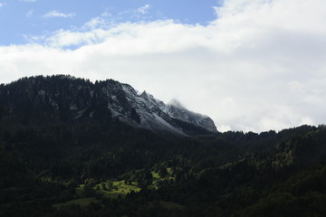 Fototapeta premium cold misty, foggy clouds on the mountains in the alps in Switzerland, Europe