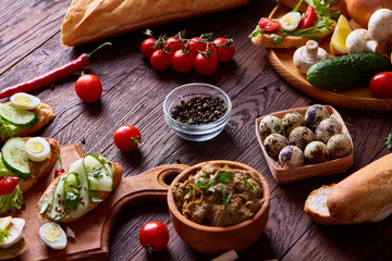 Breakfast still life with sandwiches, quail eggs, spicies and fresh fruits and vegetables, selective focus
