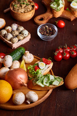 Breakfast still life with sandwiches, quail eggs, spicies and fresh fruits and vegetables, selective focus