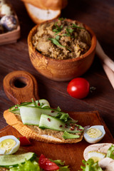 Paste from chicken liver with vegetable sandwiches , shallow depth of field, close-up, vertical.