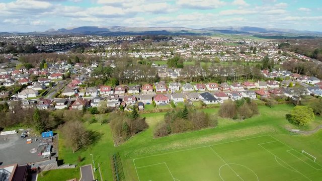 Aerial footage over Bearsden in Glasgow to the Campsie Fells in the distance.