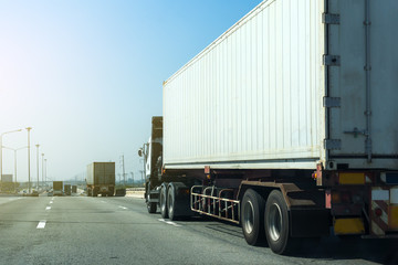 Truck on highway road with container, transportation concept.,import,export logistic industrial Transporting Land transport on asphalt expressway.with blue sky