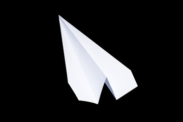 Paper airplane on a black background. paper symbol of the message
