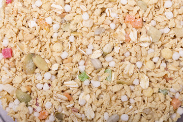Food background. Muesli with candied fruits, nuts and seeds. Proper nutrition, healthy lifestyle, diet, weight loss