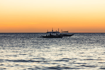 Fototapeta na wymiar Two fishing boats on the horizon