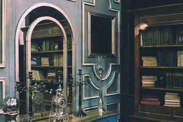 luxury and expensive interior with royal furniture, old books and silver design elements