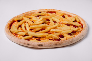 Pizza with smoked sausages and french fries isolated on white