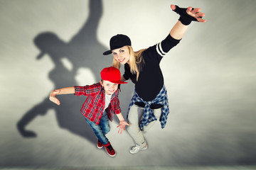 Mother and son dance hip-hop.Urban lifestyle. Hip-hop generation.	