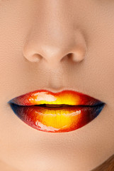 colored shiny lips of a young woman