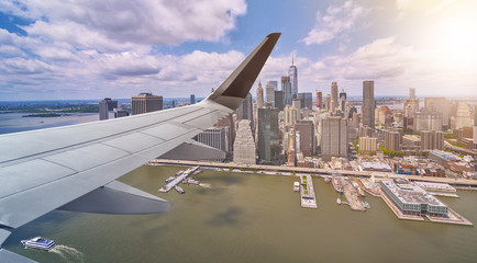 Fototapeta na wymiar Aerial New York City with airplane wing