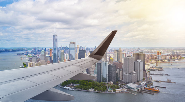 Fototapeta Aerial New York City with airplane wing