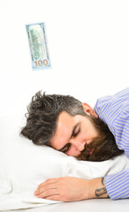 Obraz premium Man, businessman sleeps with banknote above head, white background.