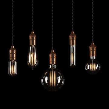Set of vintage glowing light bulbs on black background. 3D rendering.