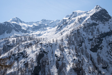 Alpine valley with snow in a sunny day in spring