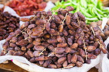 Fresh dates in a market - healthy lifestyle, food and fruit concept