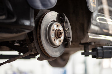 Car service station. Broken car runs maintenance process