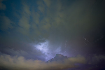 Fototapeta premium Stroke of lightning with storm clouds