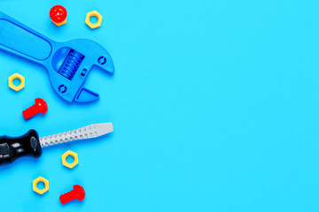 Toys background. Toy tools on blue background. Top view