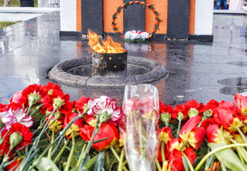 flowers lying near the monument on the victory day
