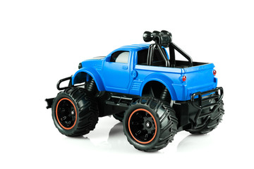 Blue RC SUV Off road truck car (Radio-controlled) isolated on white background. (This toy has some dust from children playing)