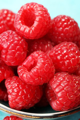 raspberries. Raspberry on blue background. Summer and healthy food concept