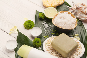 Spa background with facial mask and cream on white wood