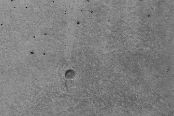 Gray concrete wall, abstract texture background, with diamond drill marks