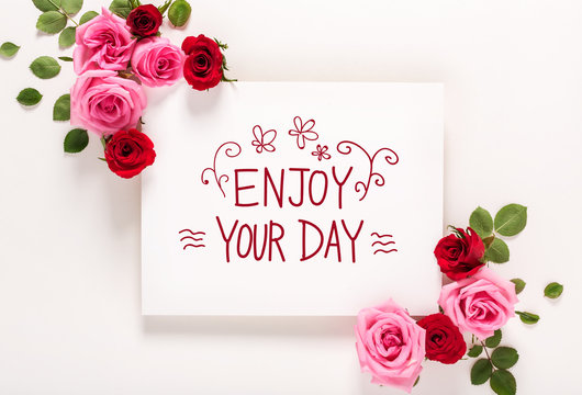 Enjoy Your Day message with roses and leaves top view flat lay