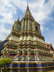 Fototapeta premium Large colorful stupa in the Phra Maha Chedi Si Ratchakan area of Wat Pho (Buddhist temple) in Bangkok, Thailand