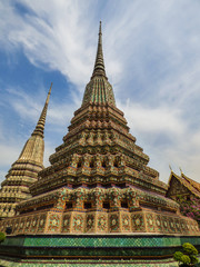 Fototapeta na wymiar Large colorful stupa in the Phra Maha Chedi Si Ratchakan area of Wat Pho (Buddhist temple) in Bangkok, Thailand