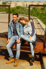 Obraz na płótnie Canvas Young beautiful attractive fashion couple wearing jeans clothes in daylight. Love concept.