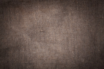 Old stained brown horizontal creasy burlap texture.