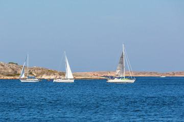 Fototapeta premium Sailboats at rocky archipelago