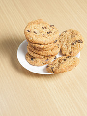 Chocolate chip cookies on wooden table background
