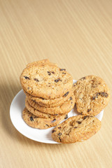 Chocolate chip cookies on wooden table background