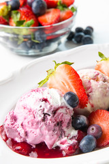 Summer theme. fruit ice cream with fresh fruit in light key on white background	