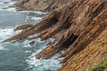 Rock Cliff by the sea with caves