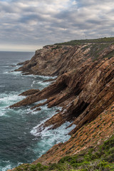 Rock Cliff by the sea with caves
