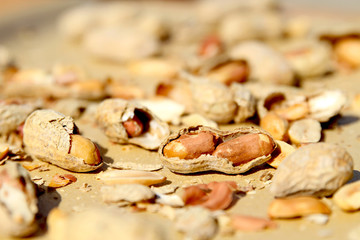 Peanuts in Broken Shells in Sunlight