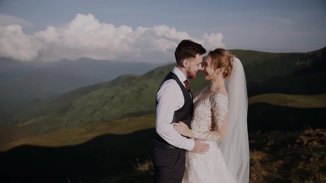 Wedding Couple Walks in Mountains 