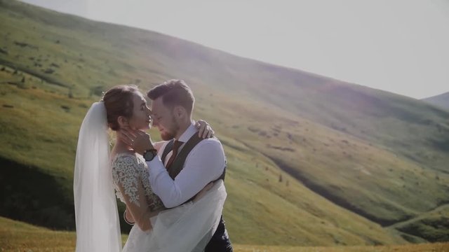 Wedding Couple Walks in Mountains 