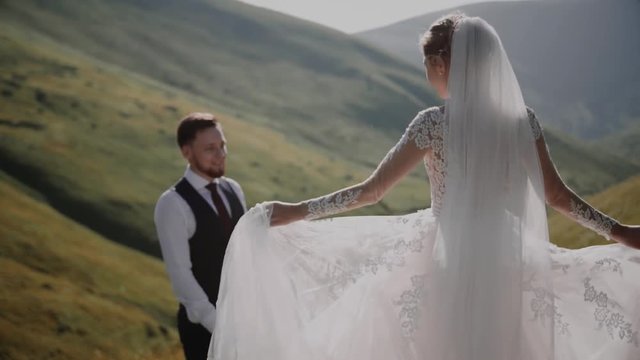 Wedding Couple Walks in Mountains 