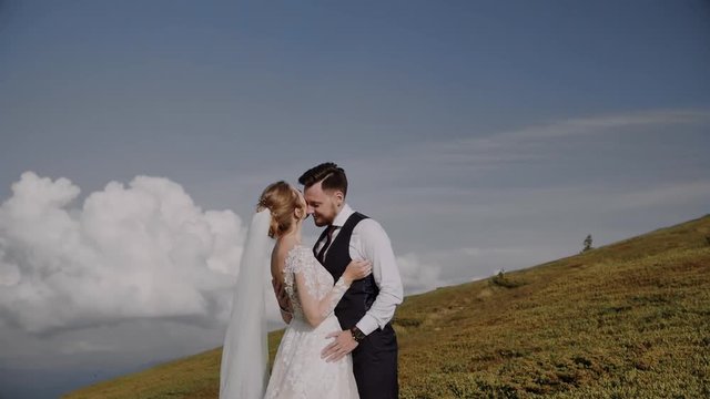 Wedding Couple Walks in Mountains 