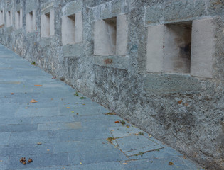 series of slits of an ancient castle /the slits were openings in the wall of the fortress to spy on...