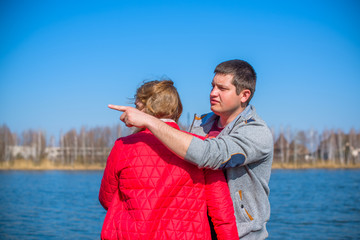 American young couple with overweight walk in park, man and woman together  