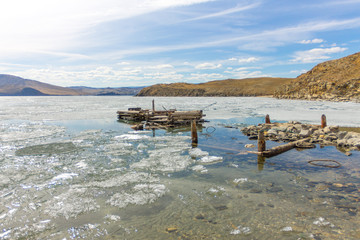 Lake Baikal in spring. old berth view of the ice drift in the small sea from the coastal rocks