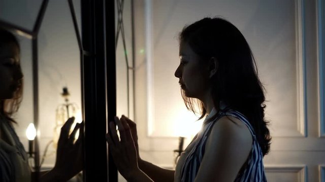 Asian woman open mirror door finding her Inner self 4K
