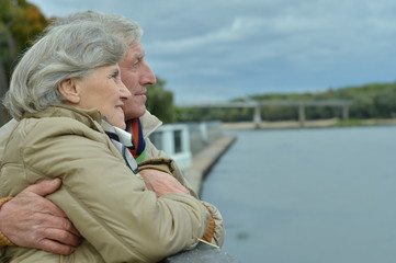 Fototapeta premium Happy senior couple near water