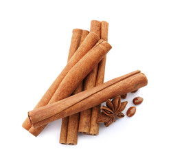 Aromatic cinnamon sticks and anise on white background